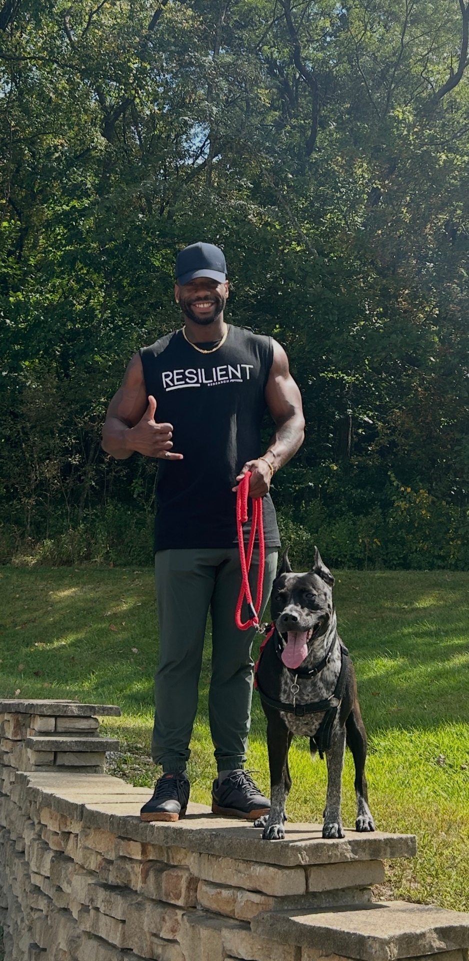 Joshua Wilcox outdoors with his dog